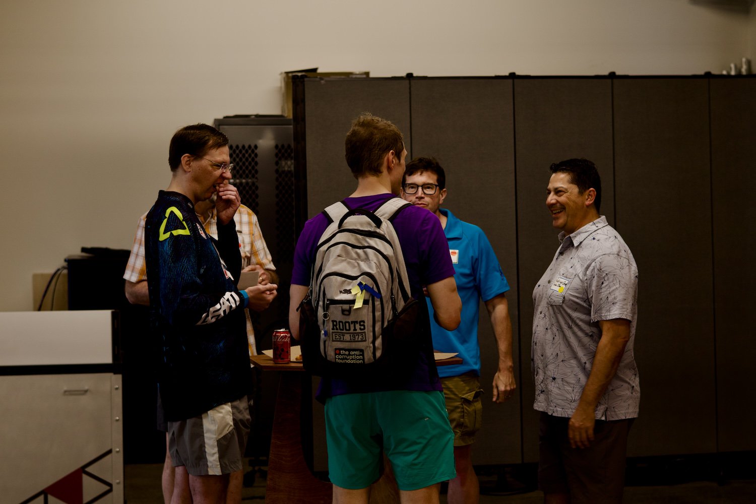 A group of people talking in a circle.