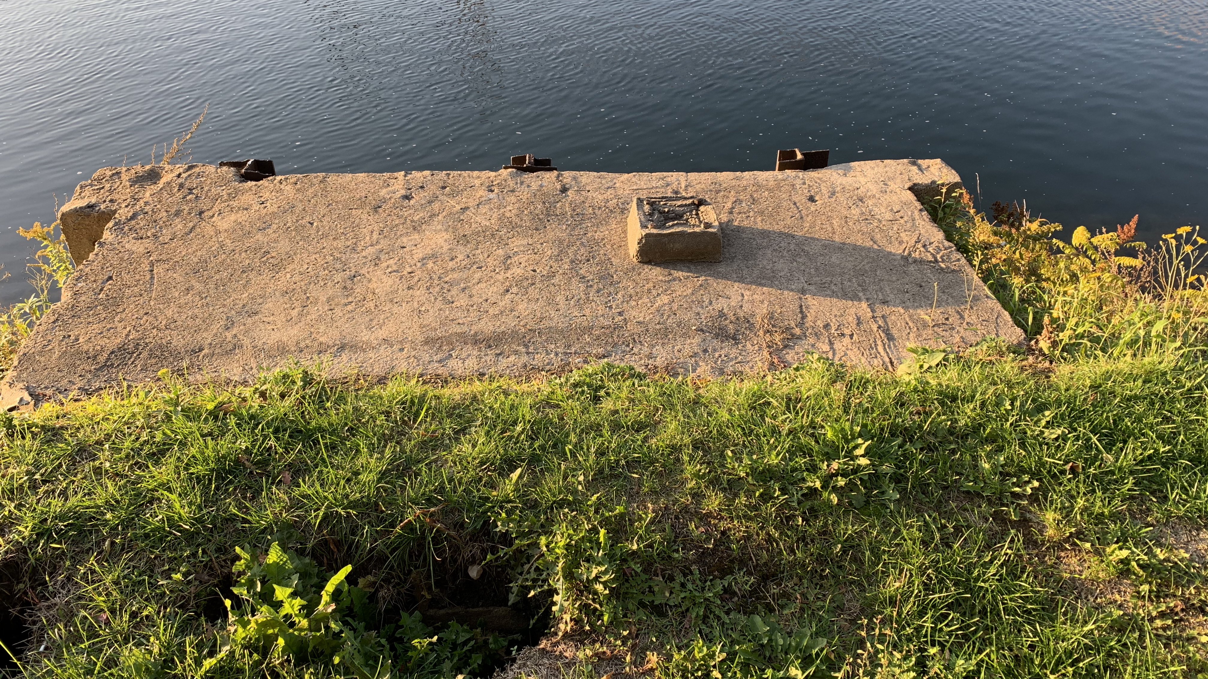 An image of A picture of some kind of industrial feature near a river in Montreal