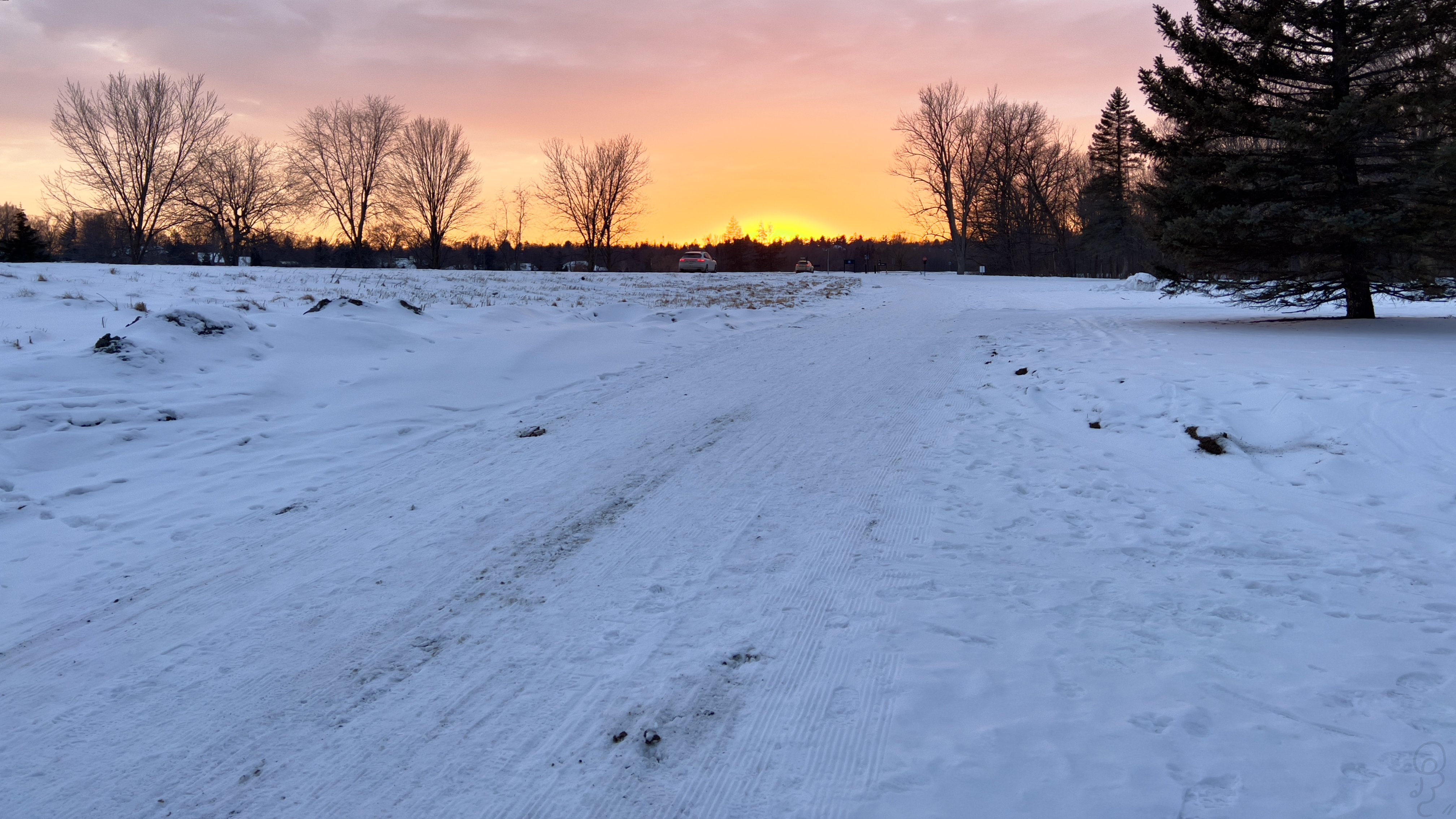 An image of A picture of the sunset taken near the Ottawa River in winter, snow covers the ground