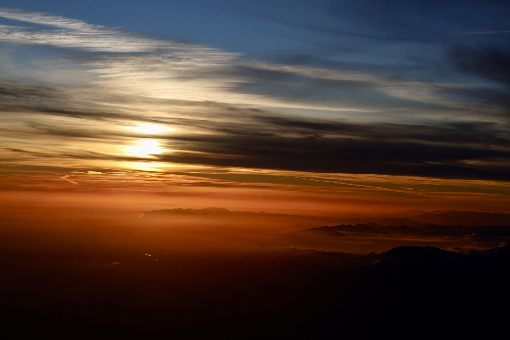 The sunset facing towards the ocean in LAX. The beautiful layers of color divide the sky into clean slices.